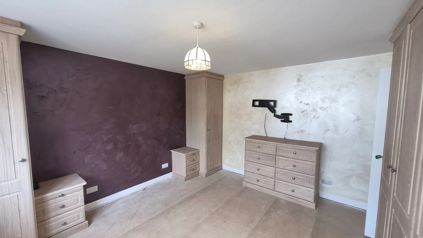 Bedroom redecorated with a polished plaster feature wall