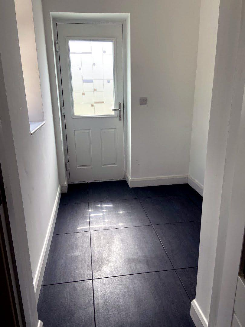 Rear porch re-tiled and decorated with a new back door