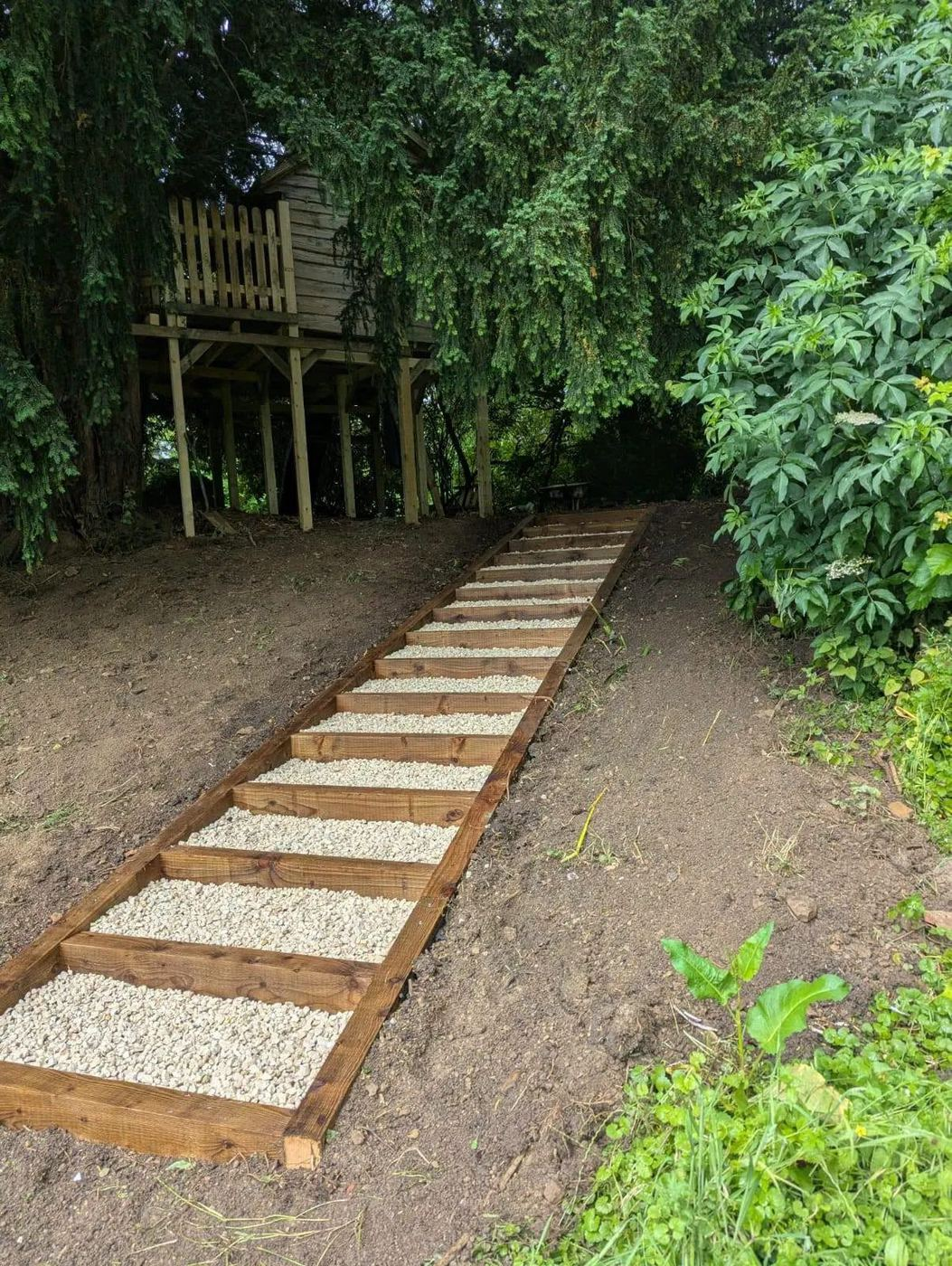 Sleeper and gravel steps built into a wooded bank