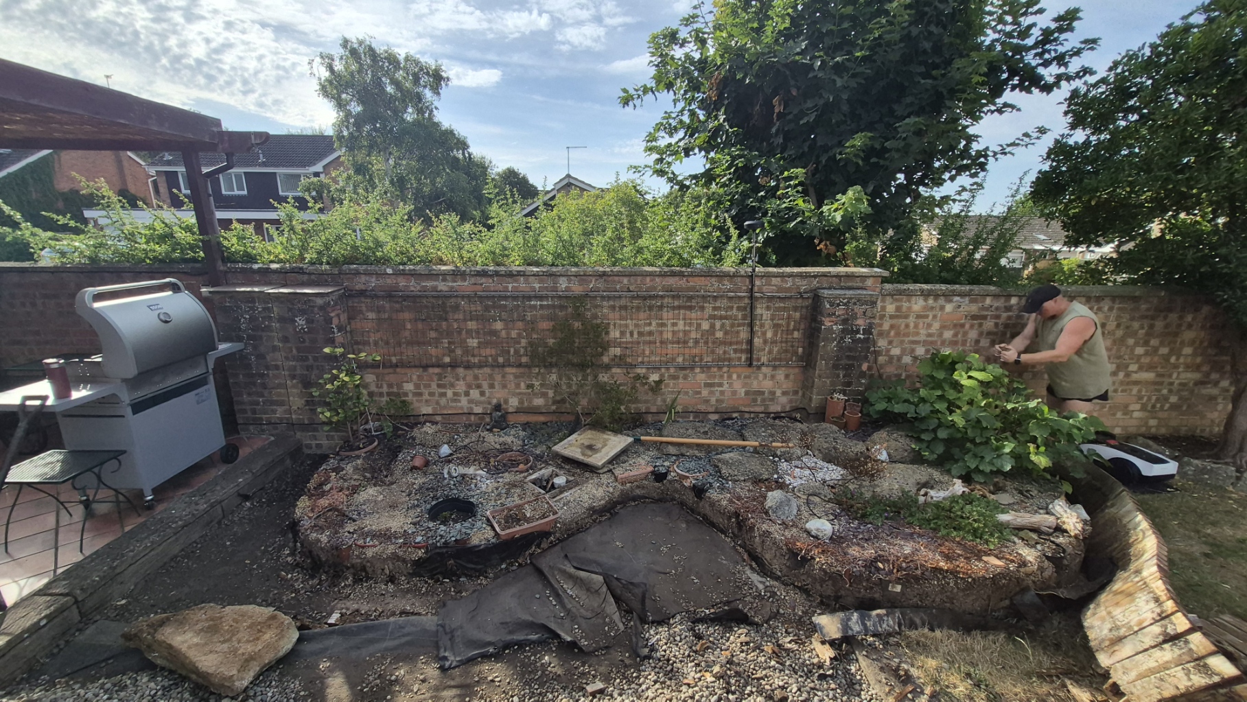 Old rockery to raised sleeper beds — before