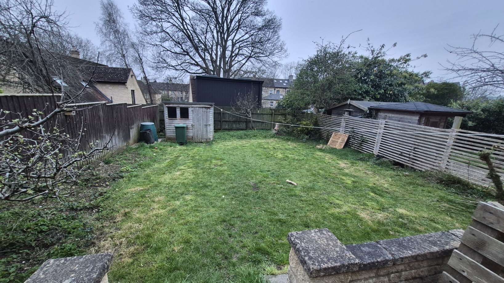 Rear garden borders and fencing — before