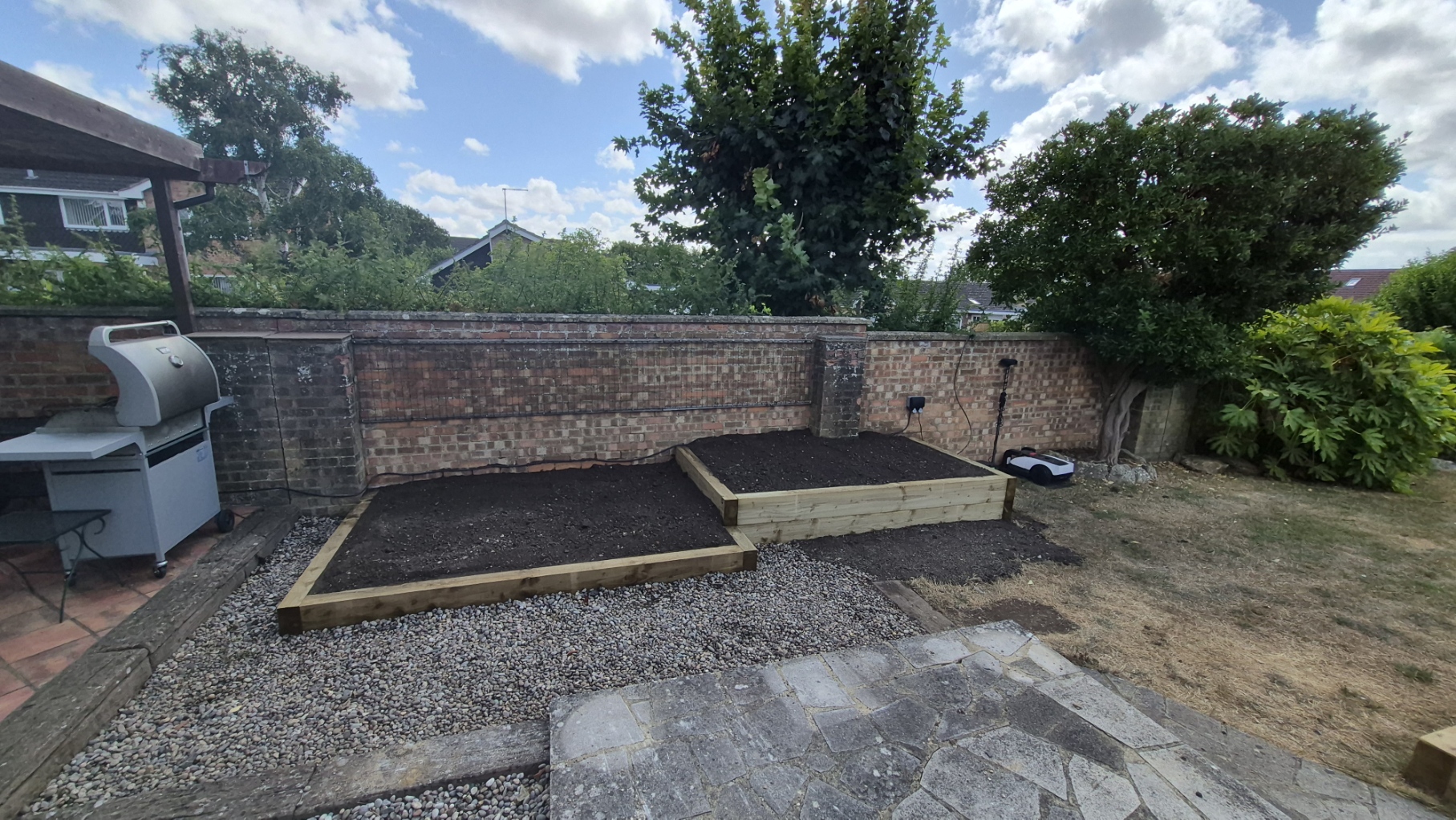 Old rockery to raised sleeper beds — after