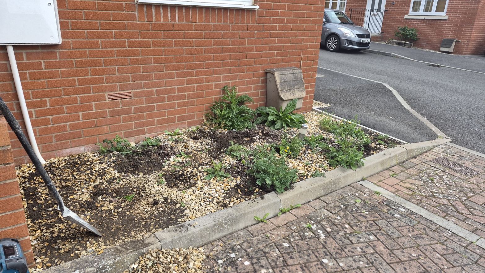 Front gravel bed — before